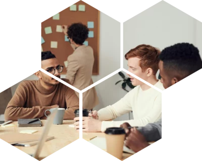 gus lab karriere 2 Hexagonale Waben maskieren ein Foto von Young Professionals an einem Arbeitstisch.